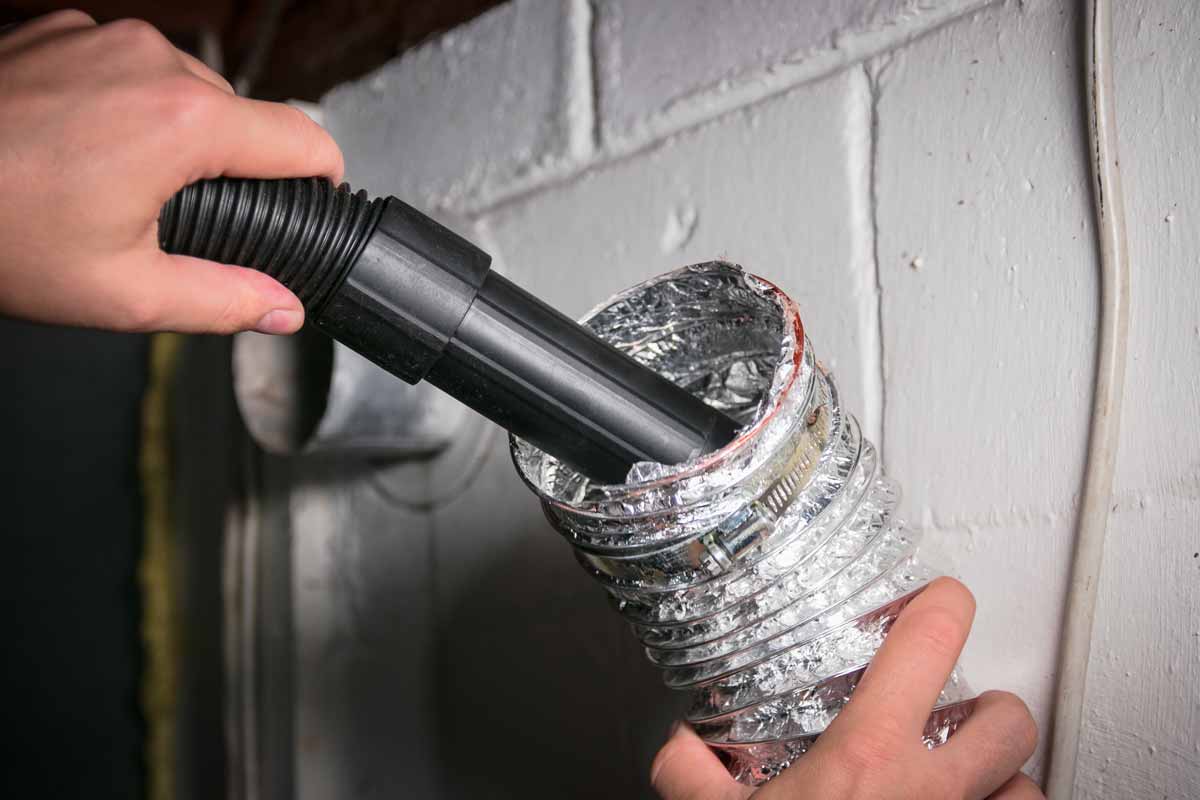 Cleaning a dryer vent with a vacuum